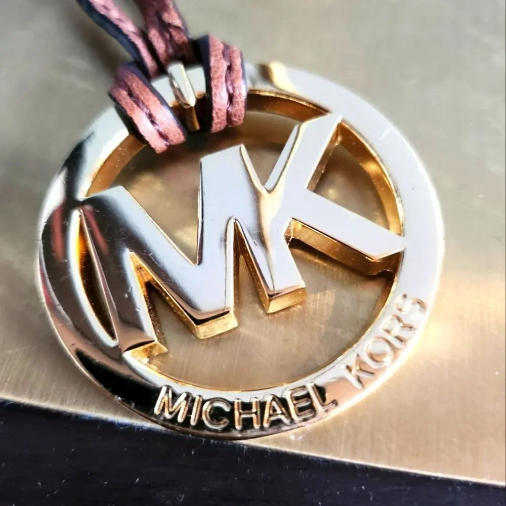 Michael Kors Gold Logo Pendant with Brown Cord